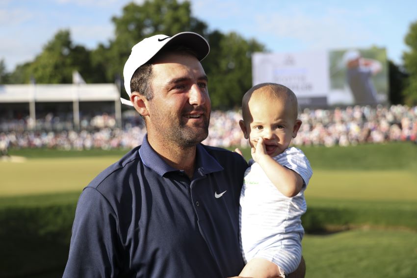 Scottie Scheffler holds his son Bennett after winning the PGA Championship at Quail Hollow Club on Sunday, May 18, 2025 in Charlotte, North Carolina. (Photo by Scott Taetsch/PGA of America)